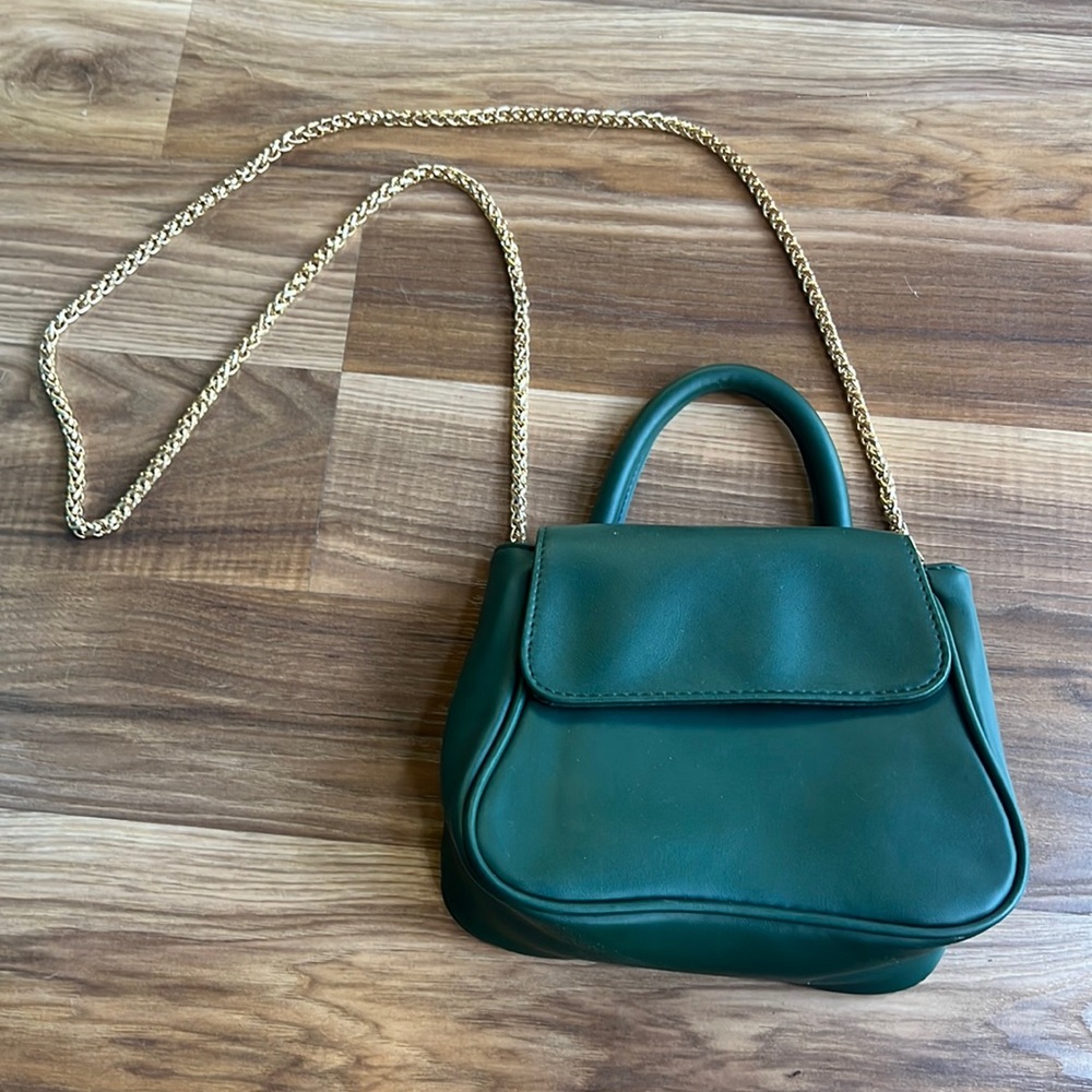 Green purse with gold chain crossbody